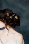 golden brass flower and leaf bridal hair pins with pearls and crystals. handmade in toronto canada by blair nadeau bridal