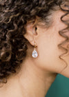 modern bridal hoop earrings with large crystal teardrops for modern brides