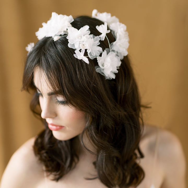 hand pressed silk georgette and silk organza flowers hand wired onto a double banded headband and wrapped with twill ribbon. Headpiece is beautifully accented with clay leaves throughout and each flower has a pearl centre. handmade in toronto canada by Blair  Nadeau Bridal Adornments