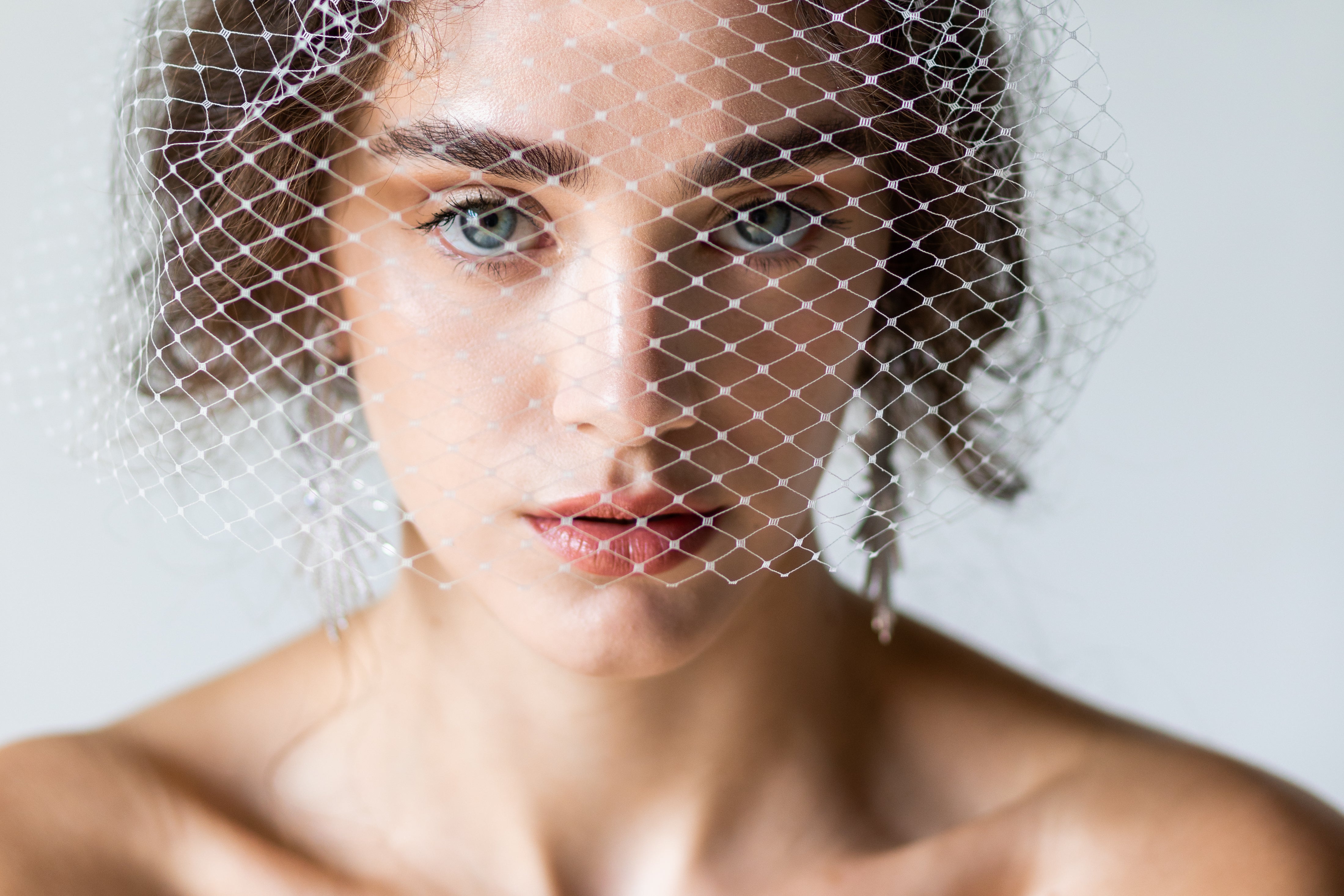 ivory birdcage wedding veil for bride that is handmade in toronto ontario canada by blair nadeau bridal adornments