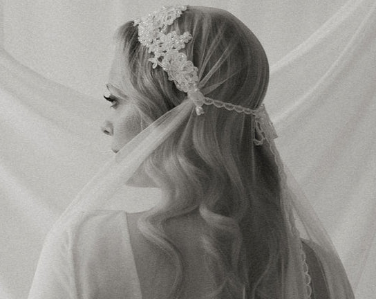 hand beaded vintage lace juliet veil with crochet lace tie on a bride with long blonde hair