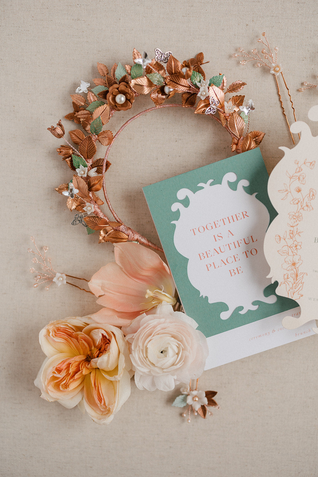 Decorative headband with flowers and a card on a beige background
