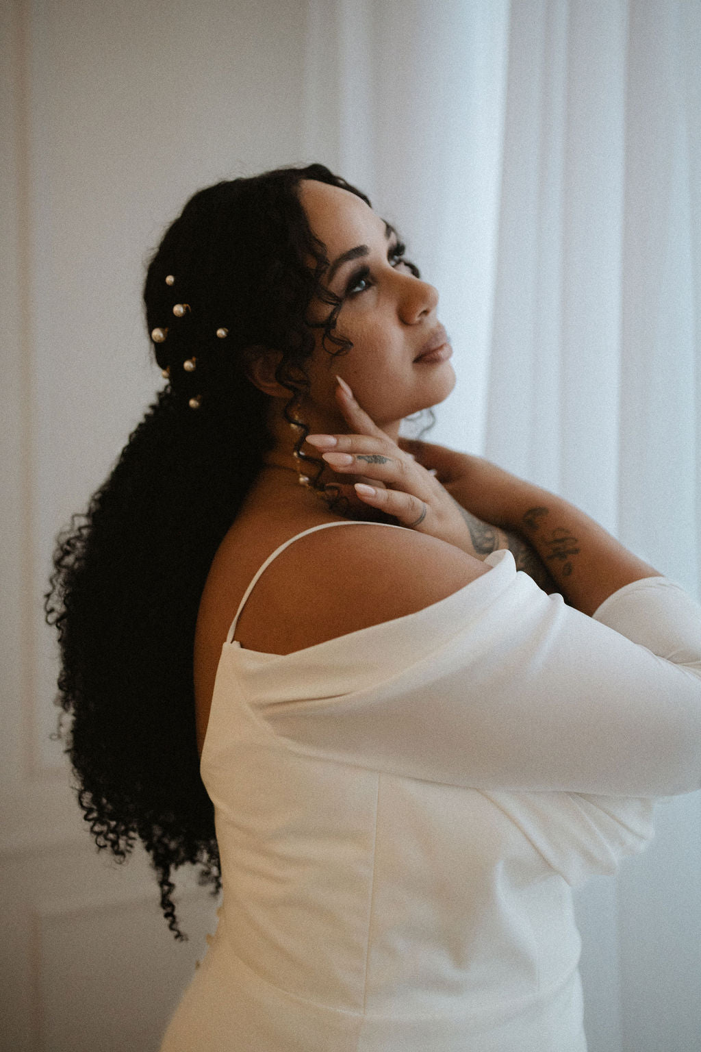 handmade in canada by Blair Nadeau, these beautiful long shoulder duster pearl earrings feature large round glass pearls and fringe tassels in sterling silver
