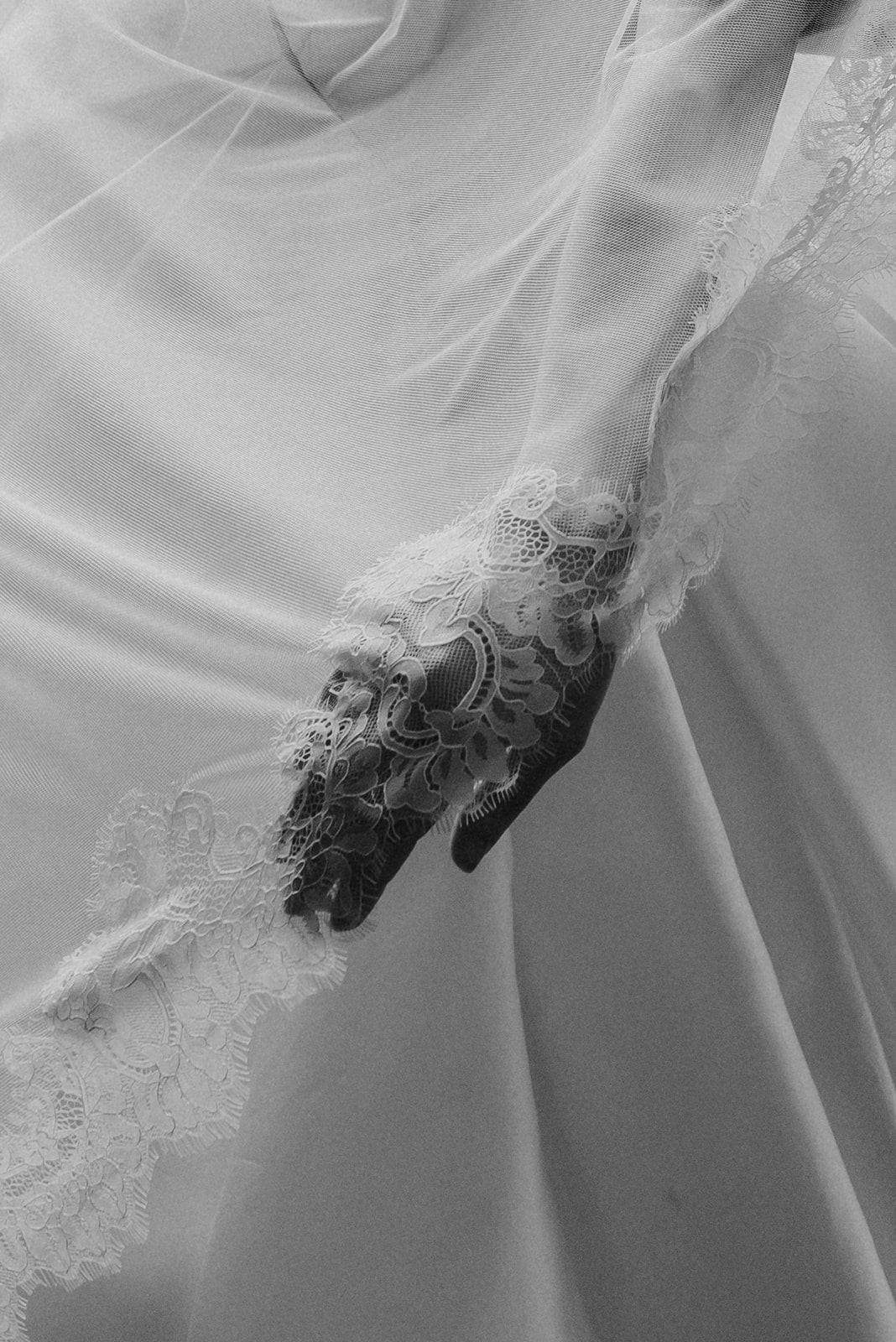 Close-up of a wedding dress with lace detailing