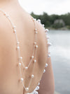 large pearl back jewelry worn by bride in Muskoka Ontario