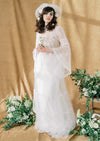 short blusher veil styled with clay flower headband and real daisies in brides hair