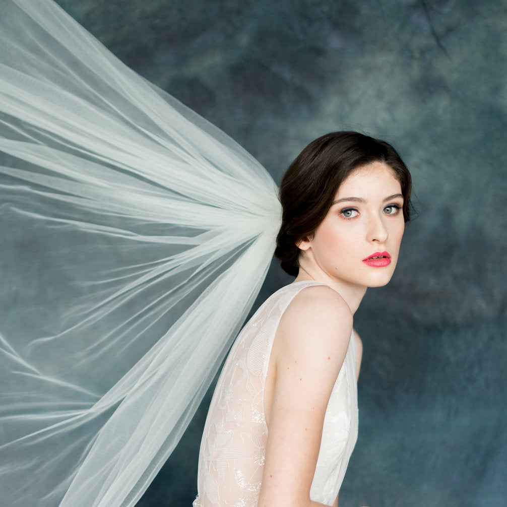 narrow white gathered comb raw cut edge bridal veil with rounded hem for weddings. made in toronto canada by Blair nadeau bridal adornments