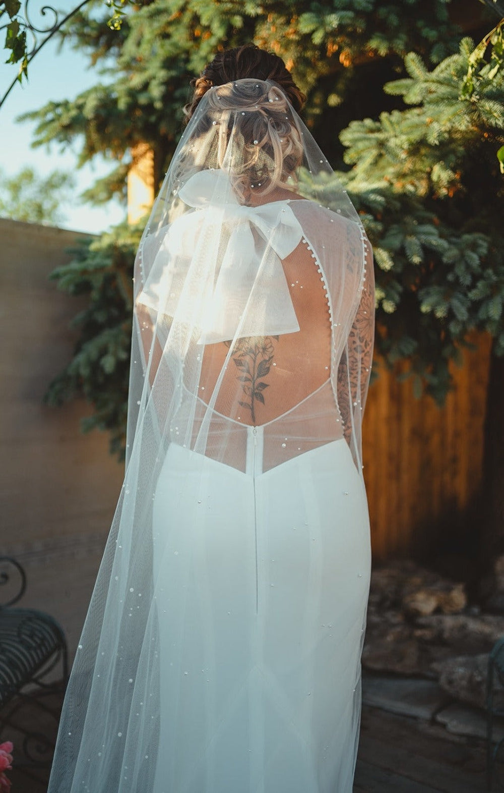 hand embellished scattered pearl bridal veil in a mantilla shape with heavy pearls at top of veil to lighter at bottom. handmade in toronto canada by blair nadeau bridal adornments