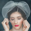 mini tulle blusher veil with small bow on comb. handmade in toronto by blair nadeau
