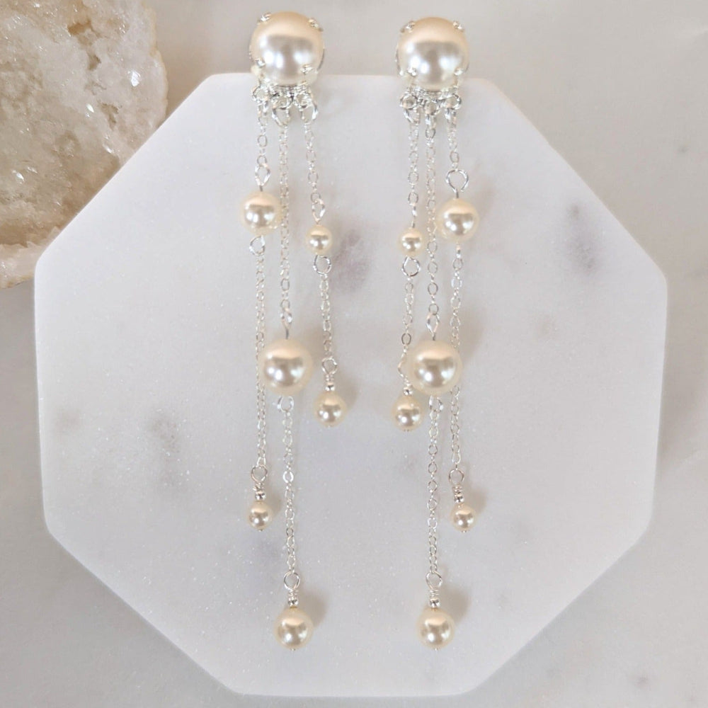 silver long pearl drop earrings with chains and large pearl studs. handmade in canada