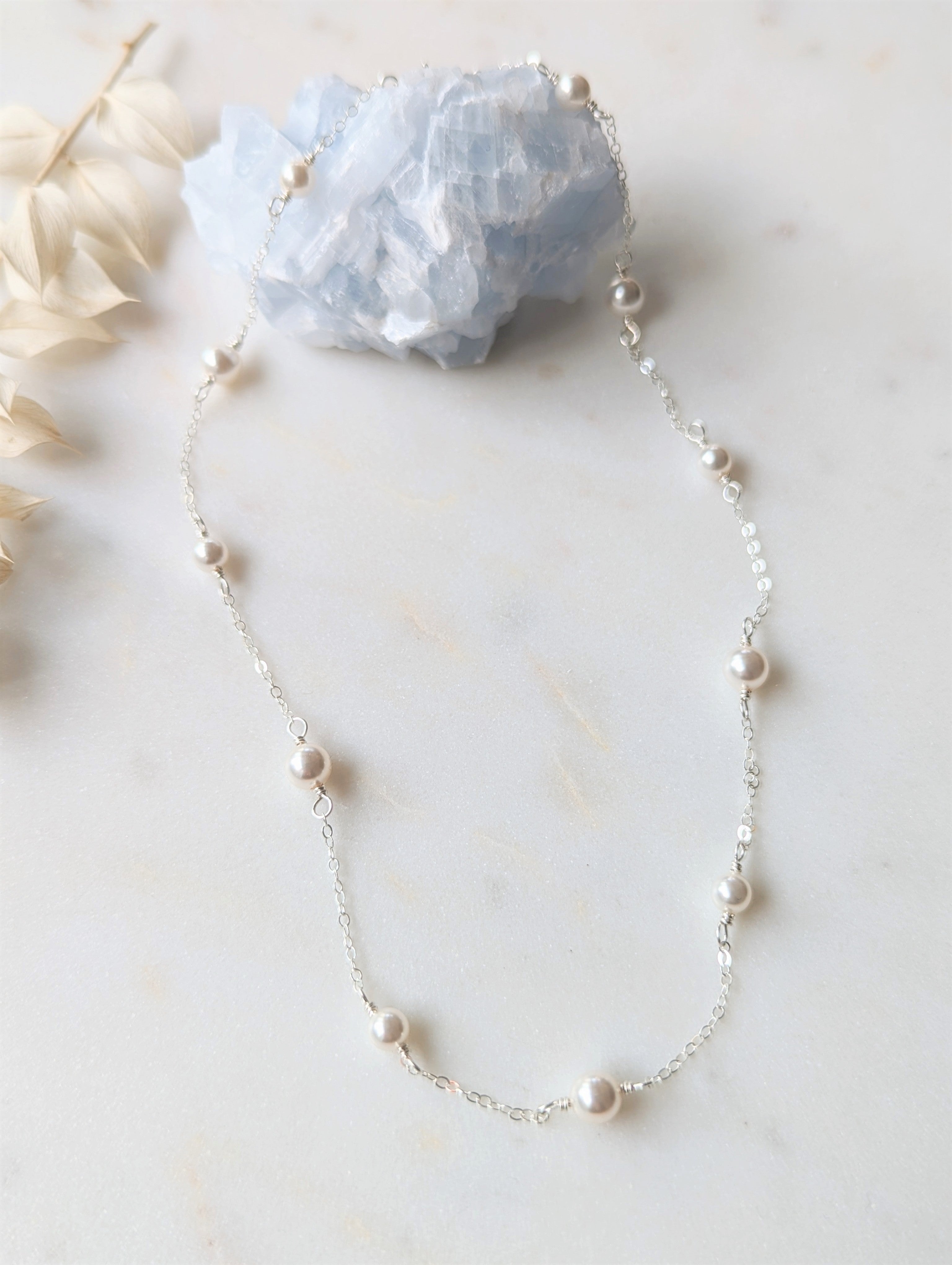 hand wired bridal pearl necklace of alternating sized glass pearls and delicate cable chain.  Close neck style with an extender chain and available in sterling silver, gold or rose gold filled finished with white, ivory, blush or iridescent pearls.. handamde in toronto ontario canada by blair nadeau bridal adornments