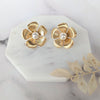 large gold flower petal earrings with pearl centres. handmade in toronto by blair nadeau
