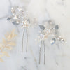 pair of silver rhinestone and clay flower bridal hair pins