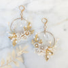 large gold hoop bridal earrings with clay flowers, okay leaves and crystal teardrops. handmade in canada