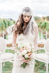 Vintage Inspired Crystal Juliet Cap Veil embellished with rhinestones, crystals, pearls and handmade silk organza flowers. Fitted cap with a long fingertip length side veil. handmade in toronto by Blair Nadeau Bridal