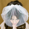 mini white birdcage veil with small mokuba ribbon bow on comb for weddings