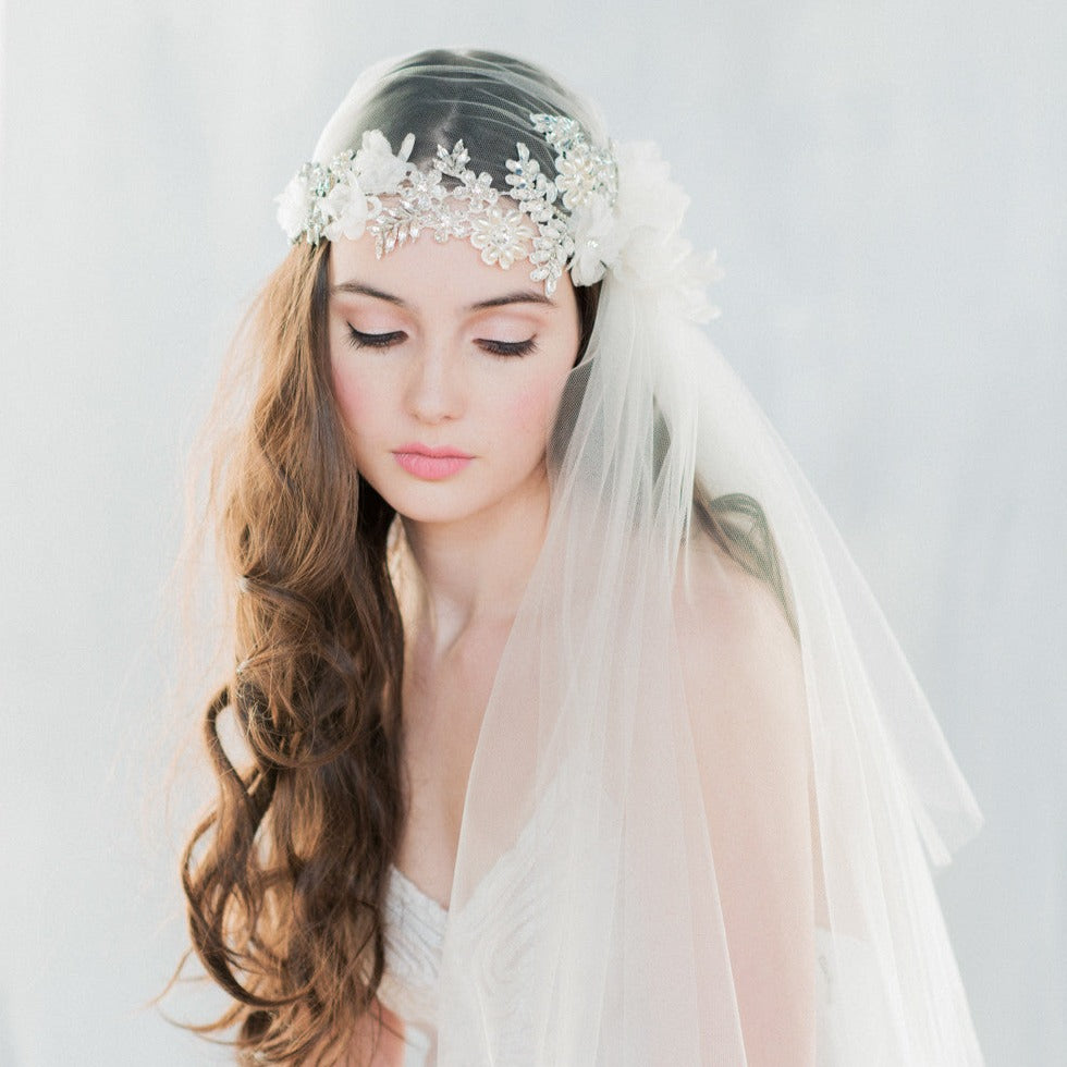 Vintage Inspired Crystal Juliet Cap Veil embellished with rhinestones, crystals, pearls and handmade silk organza flowers.  Fitted cap with a long fingertip length side veil. handmade in toronto by Blair Nadeau Bridal