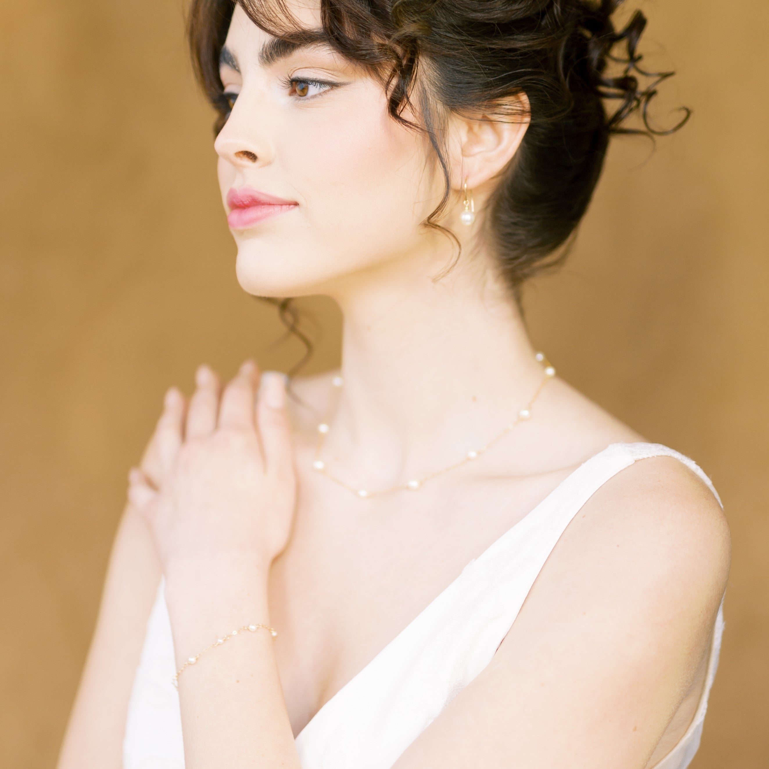 classic pearl bracelet, earrings and necklace bridal jewelry set. Necklace has round glass pearls hand linked in alternating sizes with matching bracelet. Earrings are 8mm round glass drop pearls. Available in silver, gold and rose gold. Handmade in Toronto Canada by Blair Nadeau Bridal Adornments