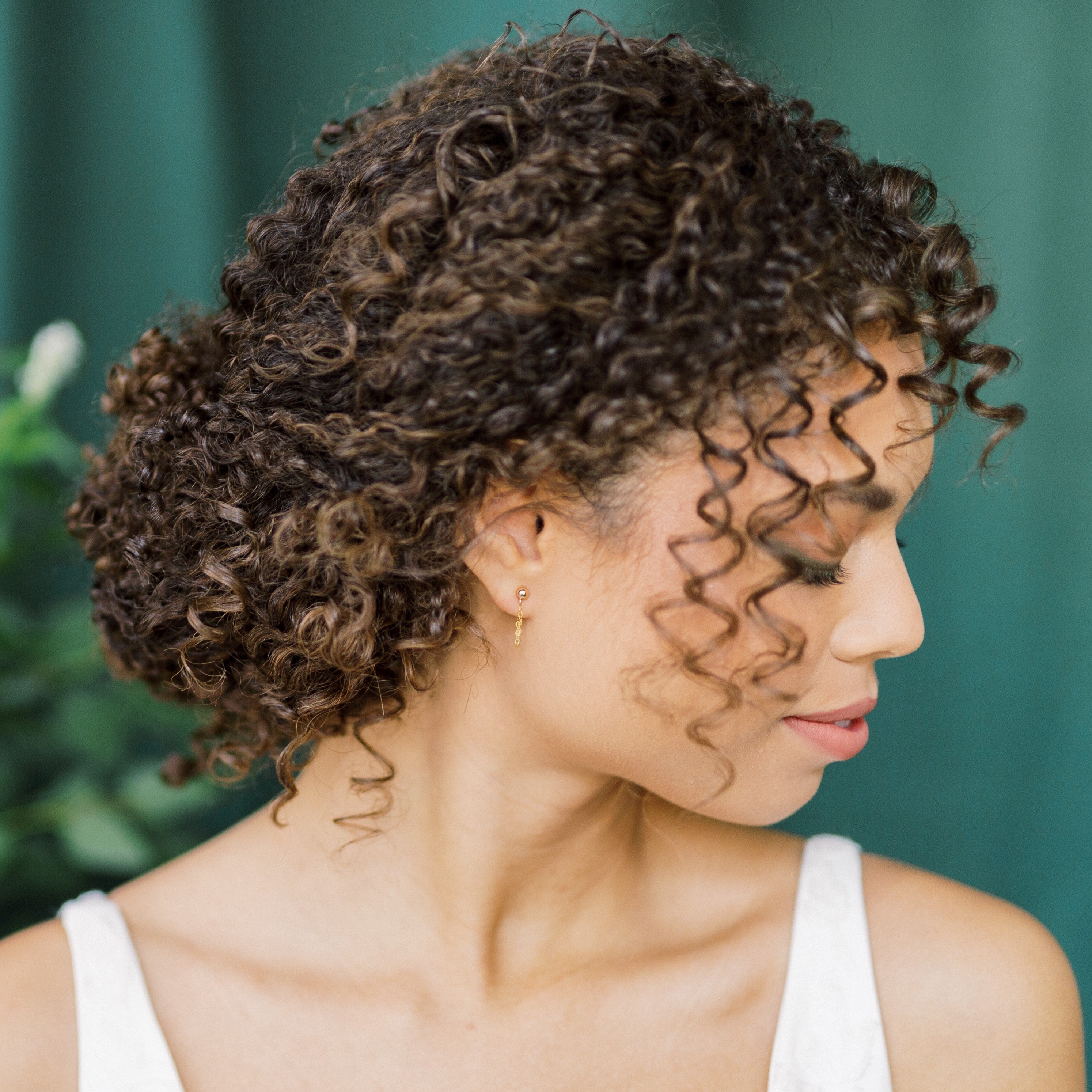 dainty chain ear huggies that wrap around the bottom of the ear lobe and connects to the butterfly backing. Modern bridal jewelry and everyday jewelry in sterling silver, rose gold filled or gold filled finishes. Handmade in toronto ontario canada