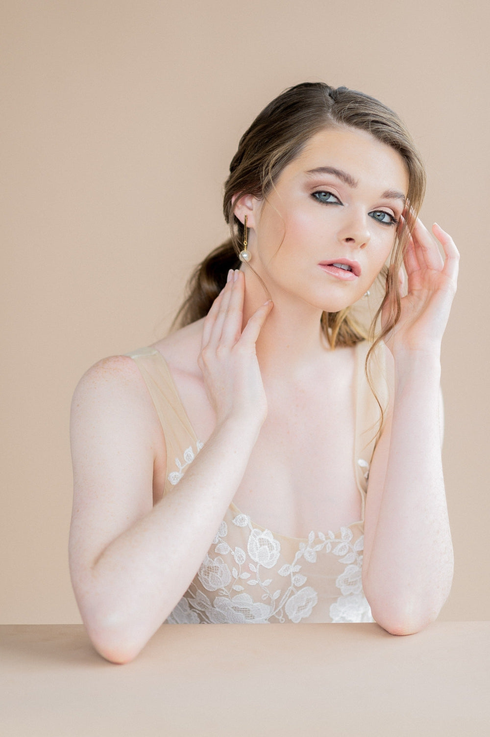 modern bridal earrings in rose gold with pearl drops