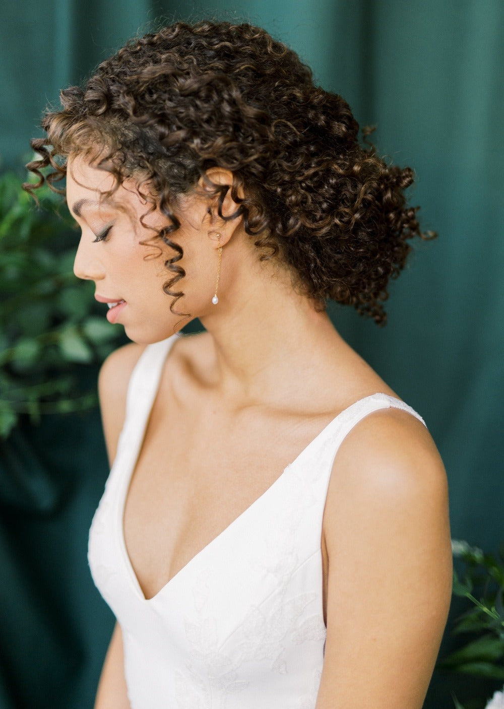 long dainty gold chain drop earrings with single small freshwater pearl drop. 