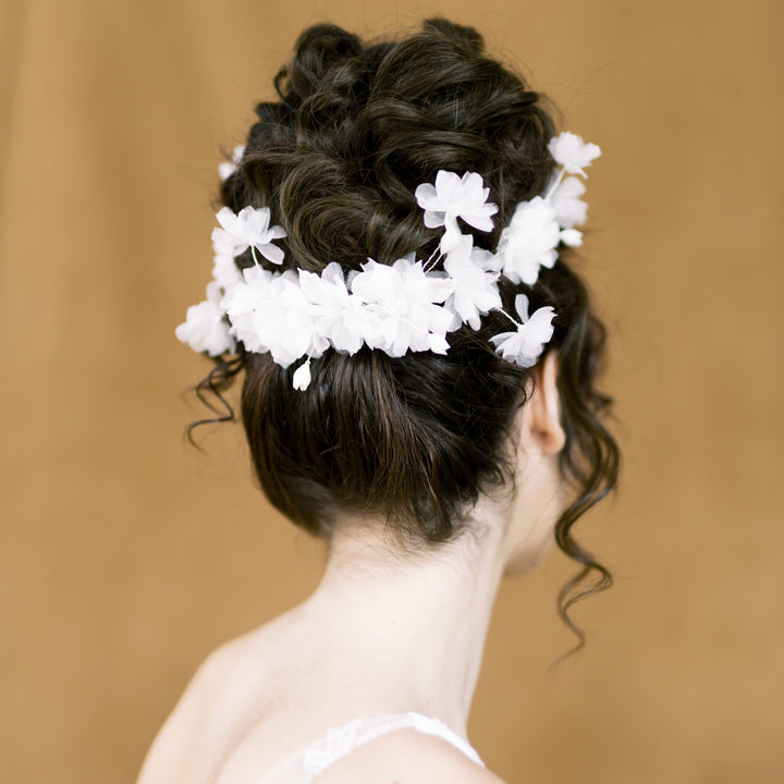 handpressed silk flower bridal hair comb with sprigs of clay flower buds, clay leaves and pearls. On 3 hair combs for a perfect wrap around fit. Handmade in Toronto Canada by Blair Nadeau Bridal Adornments