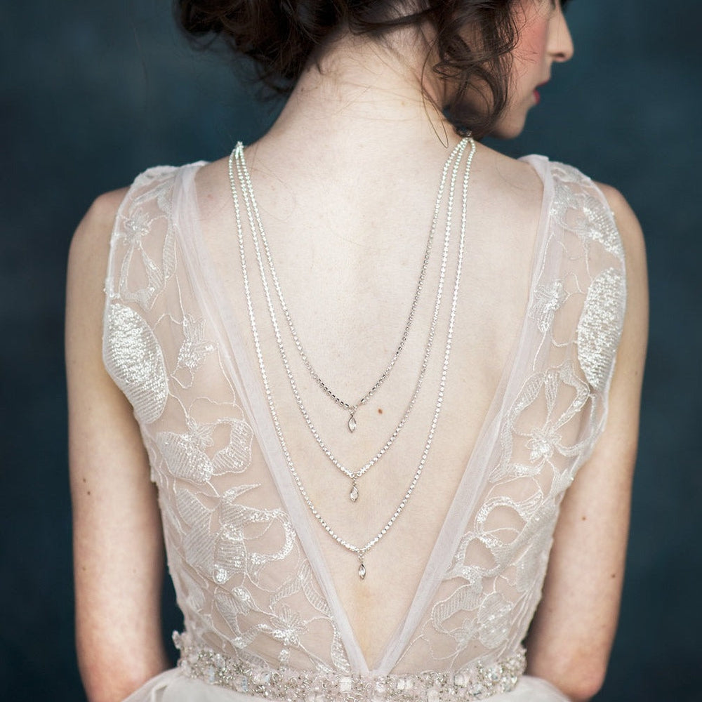 rhinestone bridal back necklace with crystal pendant drops. large pearl bridal headband for modern brides. made in toronto canada by Blair nadeau bridal adornments