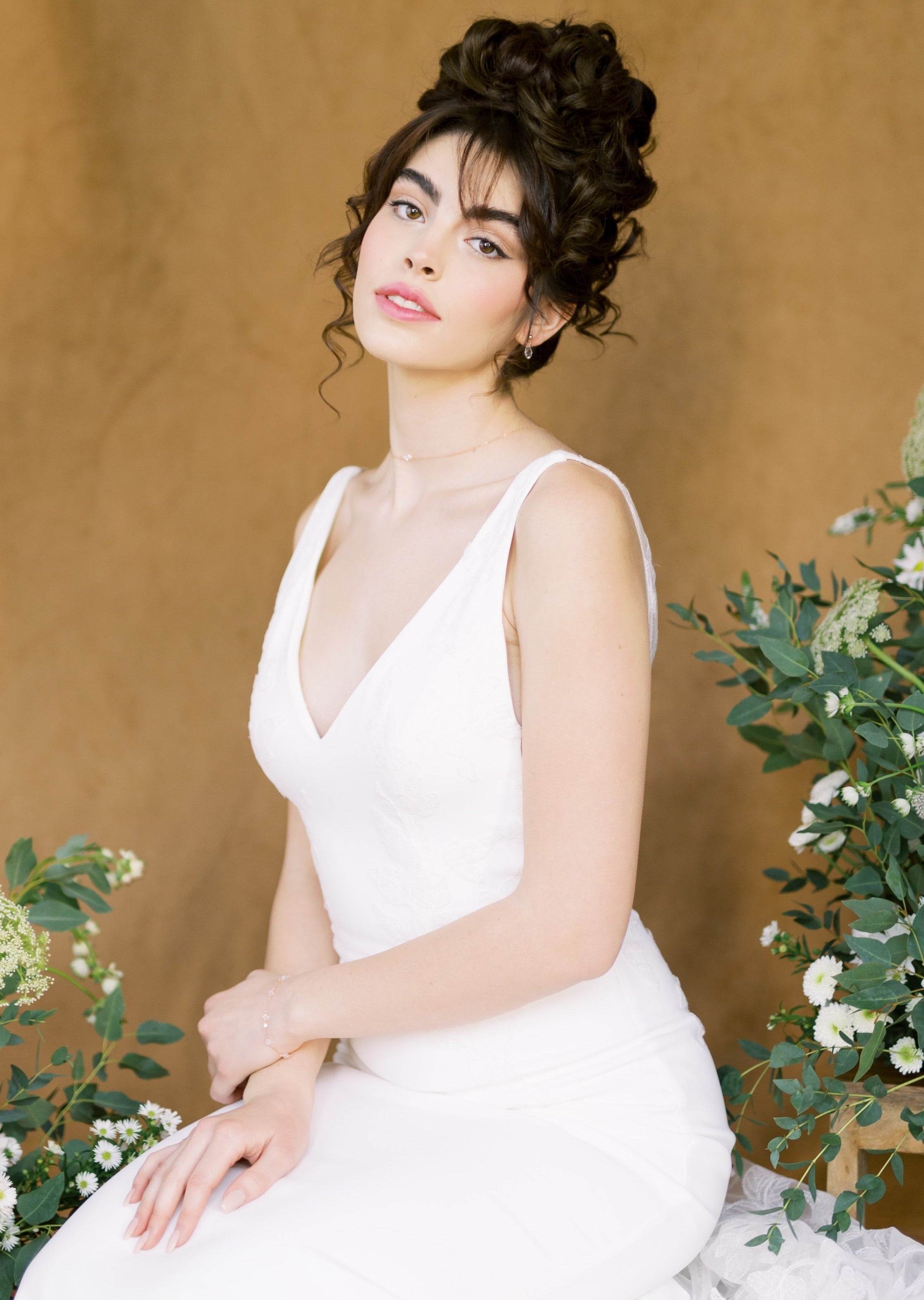 dainty crystal bridal jewelry set. Back necklace features a long drop with a pear pendant. Earrings are tiny matching pear drops with a round stud and bracelet has hand linked round clear crystal beads. Available in silver, gold and rose gold.