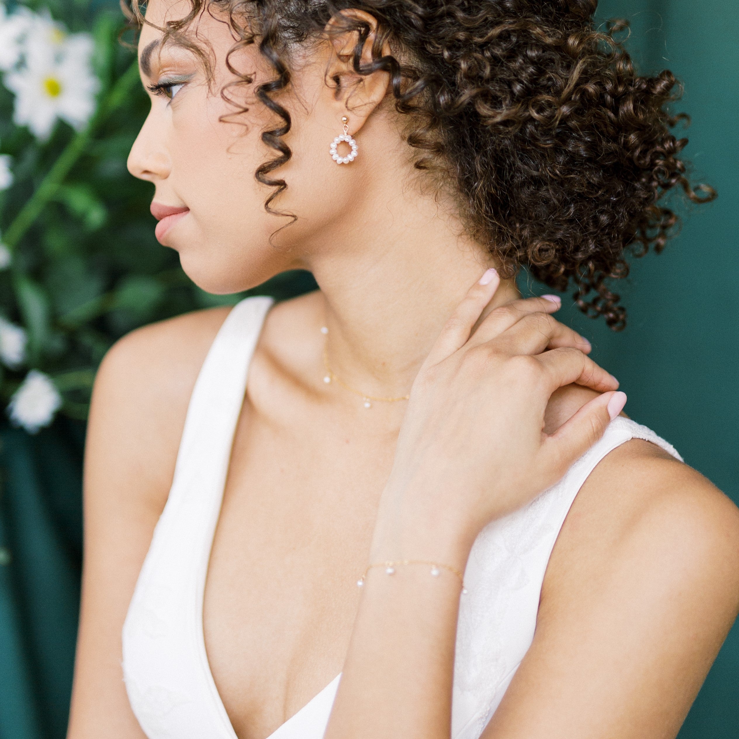 tiny freshwater pearl bridal jewelry set for weddings. Small pearl hoop earrings with 4mm stud, dainty pearl drop single strand necklace and delicate pearl drop adjustable bracelet. Handmade in Toronto Canada by Blair Nadeau Bridal Adornments