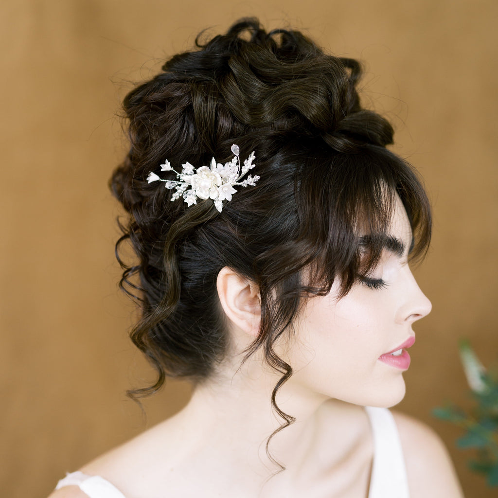 oak leaf and metal flower bridal hair comb accented with sprigs of crystals, rhinestone encrusted leaves and clay flowers. Available in silver, gold or rose gold with white or ivory flowers. Handmade in toronto ontario canada by blair nadeau bridal