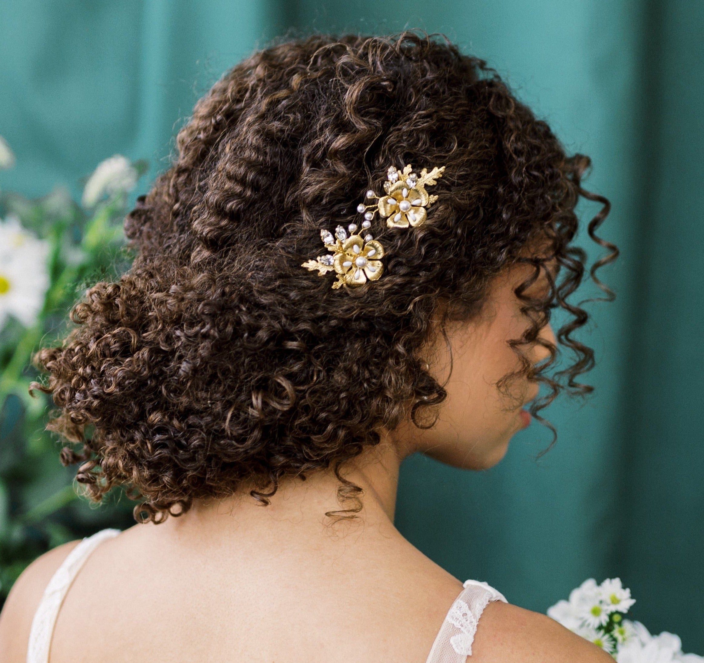 A beautiful pair of simple bridal hair pins with an oversized floral bloom, enamel painted centres and pearls.  Each flower is accented with sprigs of round glass pearls, sparkling crystals and oak leaves. Handmade in Toronto Canada by Blair Nadeau Bridal Adornments