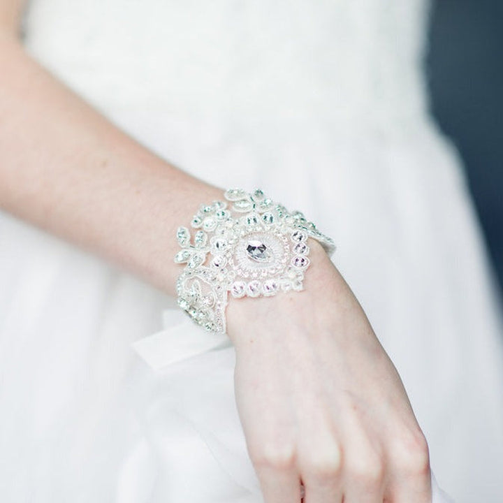 handbeaded ivory lace vintage inspired bridal cuff with ribbon tie. available in silver and gold finishes with white opal crystals and rhinestones - handmade in toronto ontario canada by blair nadeau bridal adornments