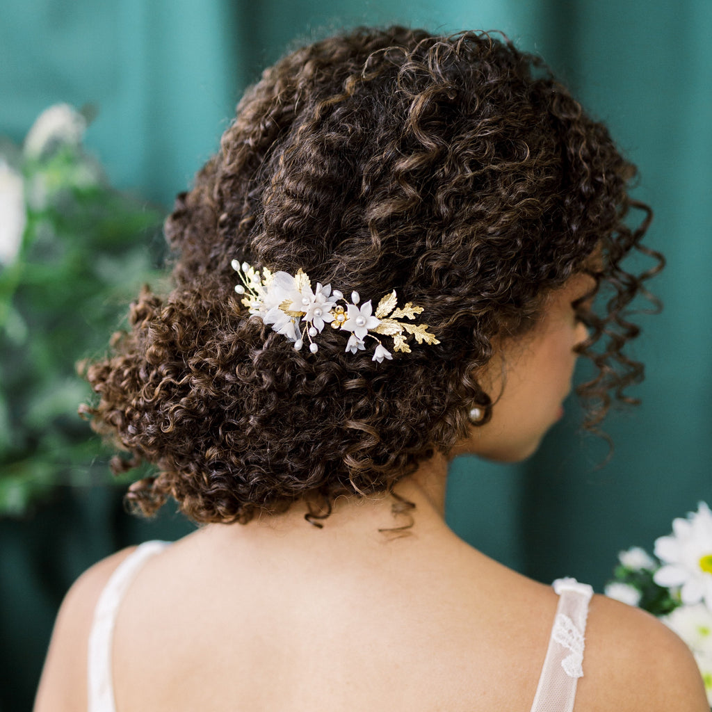 gold and ivory bridal hair cilp with clay flowers, oak leaves, rose leaves and tiny golden flowers. Handmade in Toronto Canada by Blair Nadeau Bridal Adornments