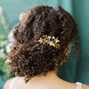 golden brass medium sized bridal hair comb with brass leaves, butterflies, pearls and small clay flower buds. Handmade in toronto ontario canada by Blair Nadeau Bridal Adornments. Available in brass with ivory or white pearls. Handmade in Toronto Canada by Blair Nadeau Bridal Adornments