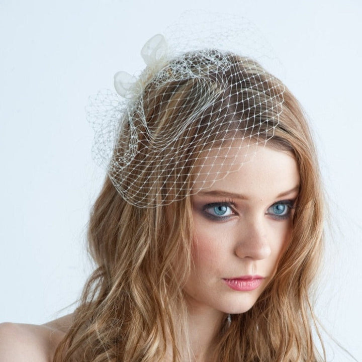 small mini birdcage veil with bow and crystals for brides. large pearl bridal headband for modern brides. made in toronto canada by Blair nadeau bridal adornments