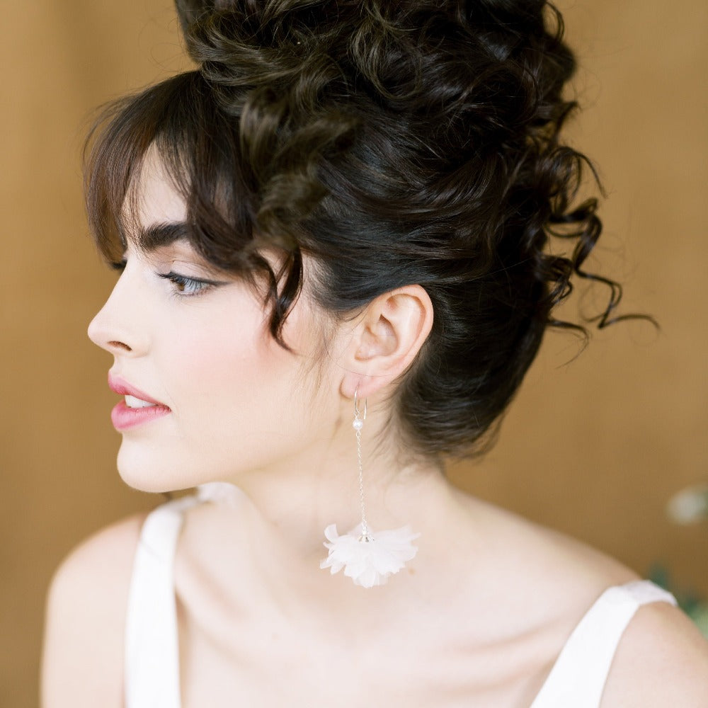 handpressed silk organza puff flowers with a pearl centre linked to a delicate sterling or filled cable chain. A beautiful glass pearl dangles from the curved ear wire. Available in pure white or ivory silk and in silver, gold or rose gold finishes. handmade in toronto canada by blair nadeau bridal adornments