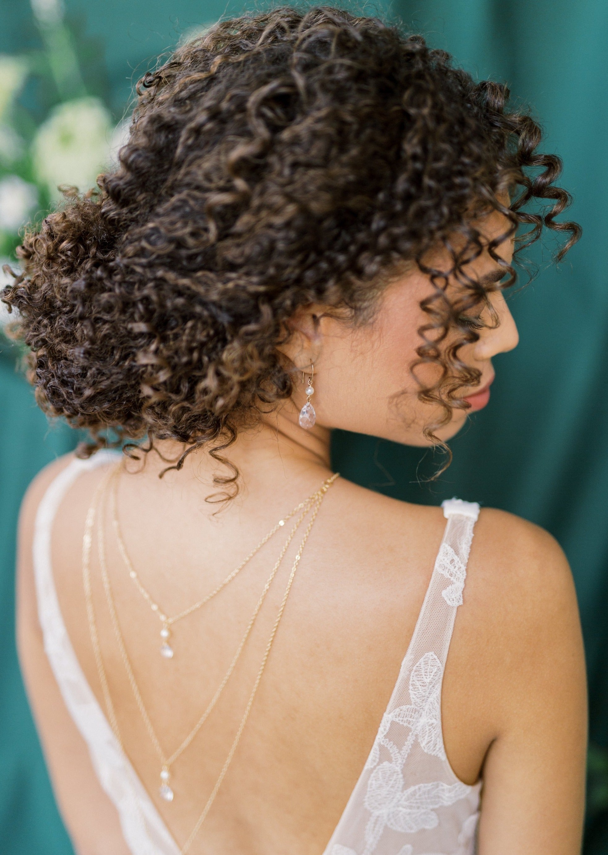 bridal earrings in gold with large crystal teardrops and round glass pearls. Modern wedding jewelry