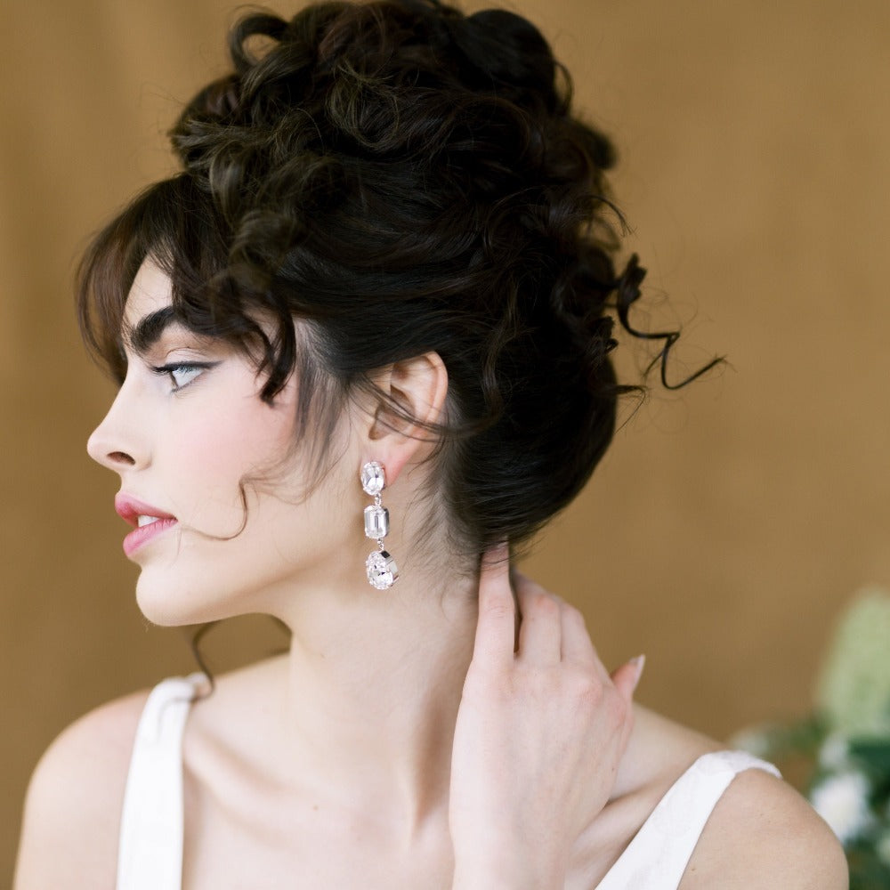 large crystal rhinestone bridal earrings with pear, octagon and oval oversized crystals handset into plated settings with surgical steel posts.  Available in silver, rhodium, rose gold and gold finishes. handmade in toronto ontario by Blair Nadeau Bridal Adornments