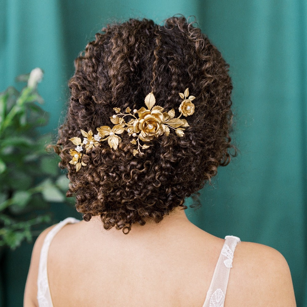 Large golden brass hair vine with large rose flower and various leaves and flowers along vine. Handwired to haircomb and mouldable to suit any hairstyle. Handmade in Toronto Ontario Canada - Blair Nadeau Bridal Adornments - As seen in Munaluchi Bride