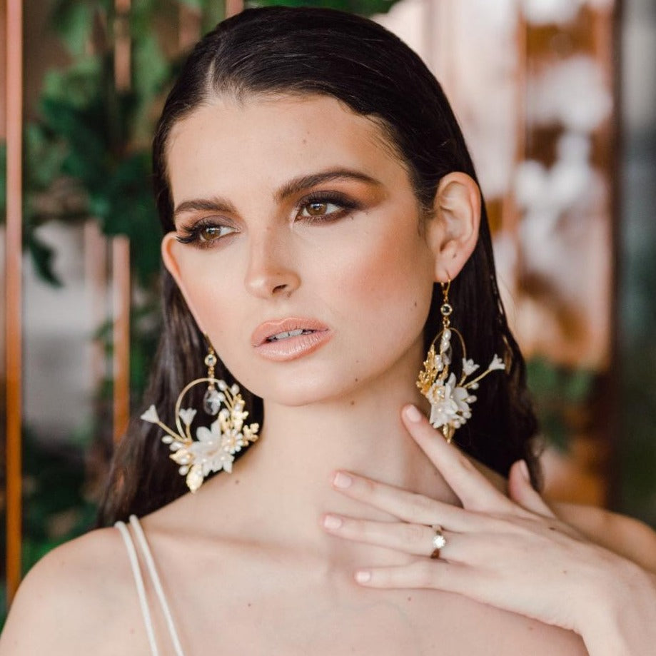 large gold statement bridal hoop earrings with clay flowers and crystal teardrops. made in toronto canada by Blair nadeau bridal adornments