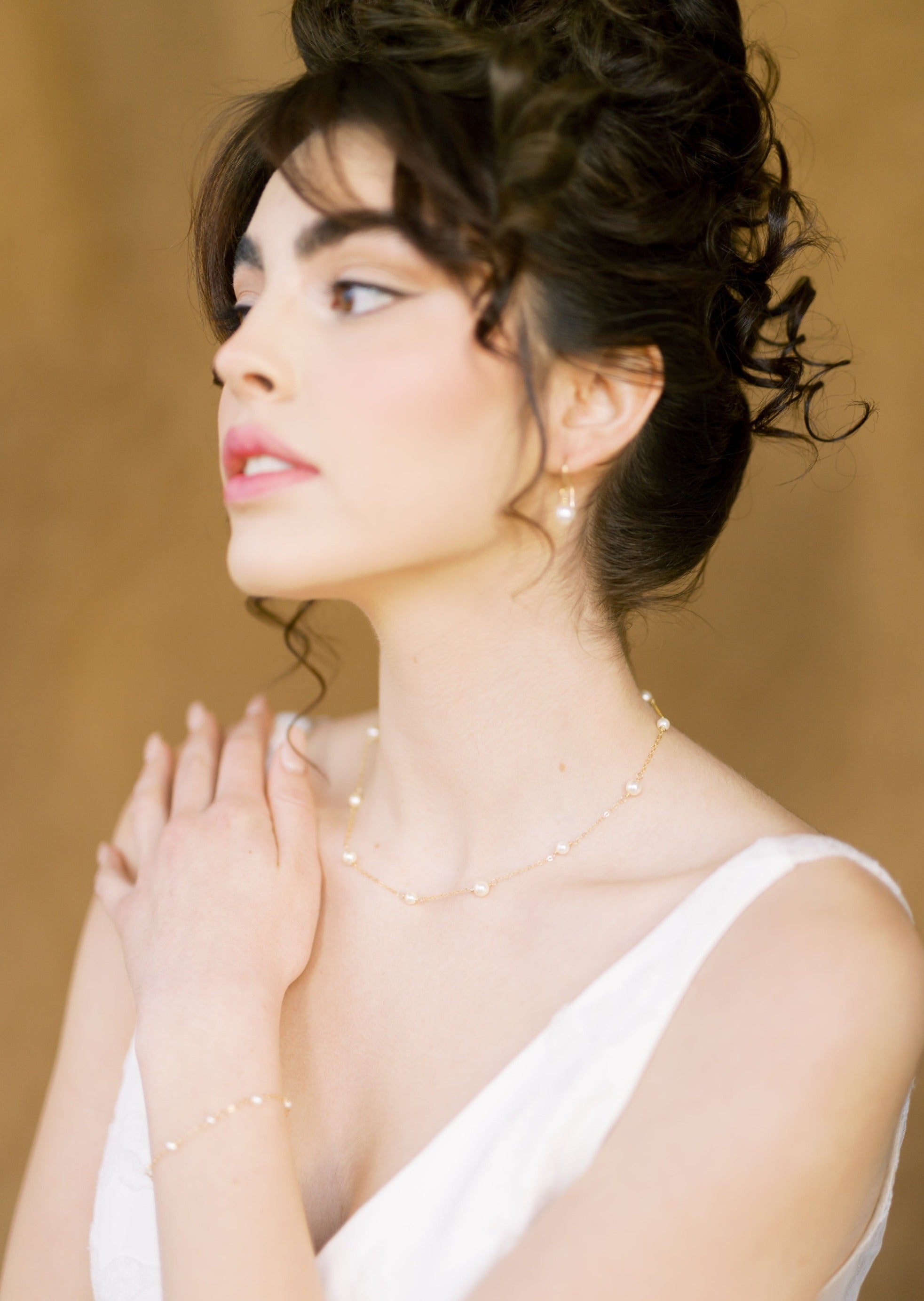 pearl bridal necklace, earrings and bracelet set. Necklace and bracelet have hand linked round glass pearls in alternating sizes and the earrings are a beautiful round drop pearl on a modern ear wire. Available in silver, gold and rose gold.