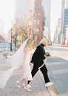 super sheer and ultra soft whisper tulle. This beautiful veil is lightly hand gathered and stitched to a metal wire comb. This veil features a beautiful blusher veil that hangs delicately. Available in pale ivory, off white, pure white and black. handmade in toronto ontario canada by blair nadeau bridal adornments
